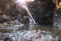 sunlight over a waterfall 