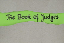the book of judges - torn open kraft paper over green paper with the name of the book of Judges