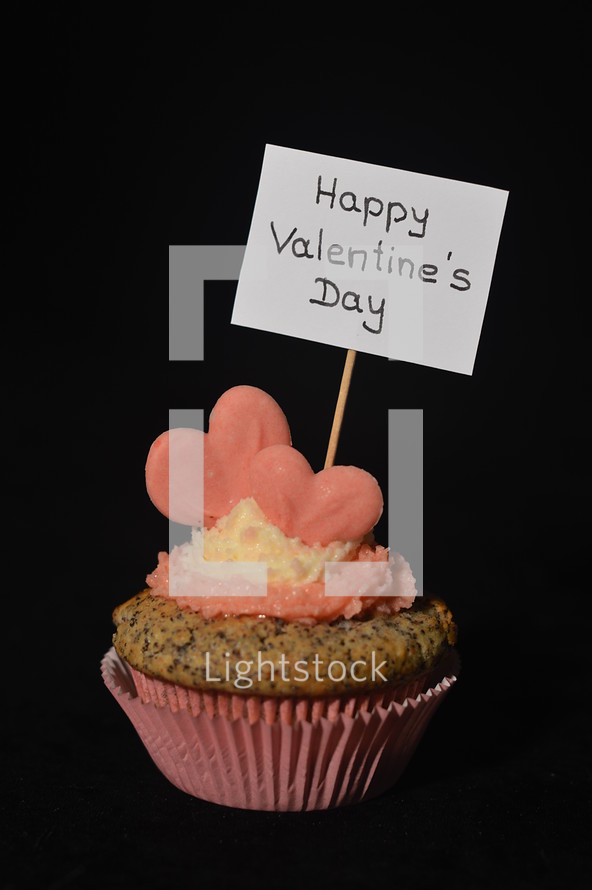 Cupcake for my sweetheart. 
cupcake, in love, love, Valentine, couple, Valentine's Day, February, 14, enamored, amorous, fond, lovestruck, twosome, relationship, romance, heart, hearts, delicious, tasty, yummy, pink, rose, celebration, invitation, cupcakes, joy, food, eat, eating, sweet, festivity, invite, present, gift, homemade, home made, home-made, self, self-made, bake, baking, baker, pastry, cook, confectioner, coffee cake, celebrate, celebrating, feast, enjoy, relish, savor, appreciate, creme, topping, happy, sign, plate, tag, written, writing, write, words, word, greeting, greetings