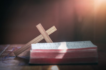 wooden cross and open Bible 