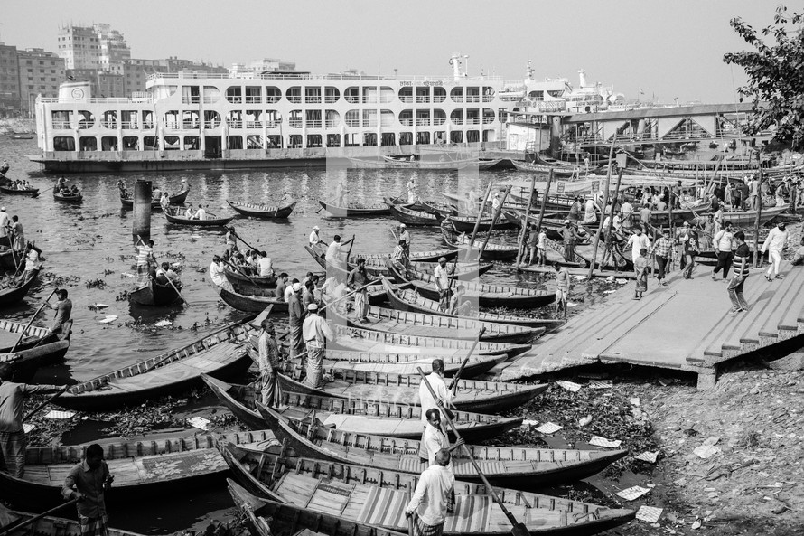 Boats with fishermen in Dhaka river in Bangladesh