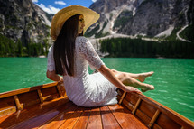 a woman on a boat over a green sea 