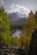 mountain forest and lake in fall 