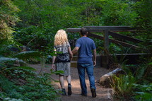 a couple walking on a path in a park - on the way as a couple