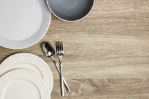 plates and silverware on a countertop 