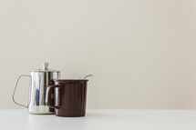 silver coffee pot and mug 