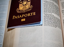 passport on an opened Bible 