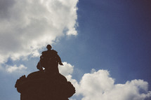 Silhouette of a monument under the clouds.