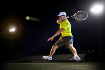 man hitting a tennis ball