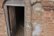 open door on a brick cellar