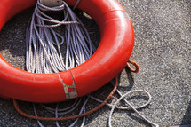 Life preserver, lifesaver or lifebuoy and securing rope  