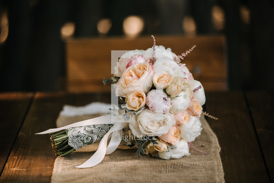 bride's bouquet on a table runner 