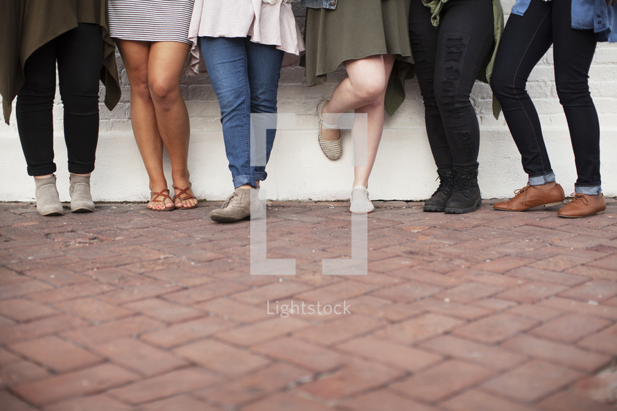 legs of a group of young women