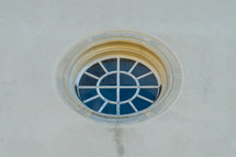 Circular window in white building