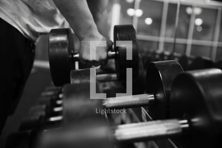 man lifting weights at the gym