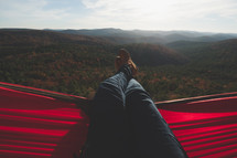 relaxing in a hammock on a mountaintop 