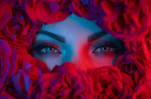 Macro portrait beautiful woman in bath, face with perfect make-up in roses flowers decoration. Concept of skin rejuvenation, spa treatments, perfumery. High quality