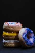 donuts on a black background 