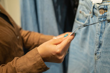 Young woman shopping for jeans