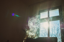 smoke in front of a window 
