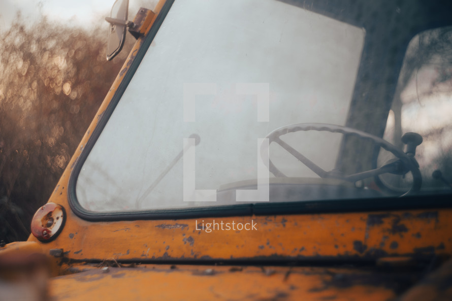 Digger tractor window windshield, heavy construction excavator machinery close-up