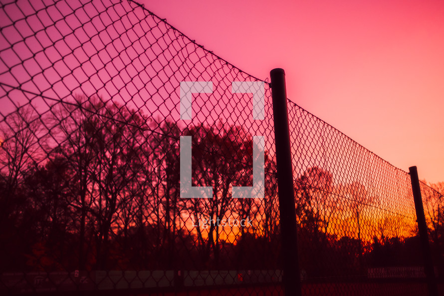chain link fence at sunset 