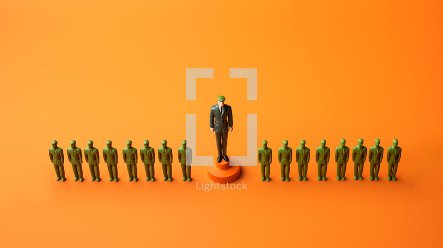 Plastic green army men in formation with a commander on an orange background.