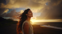 Young Hawaiian woman looking up at the sky. 