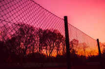 chain link fence at sunset 
