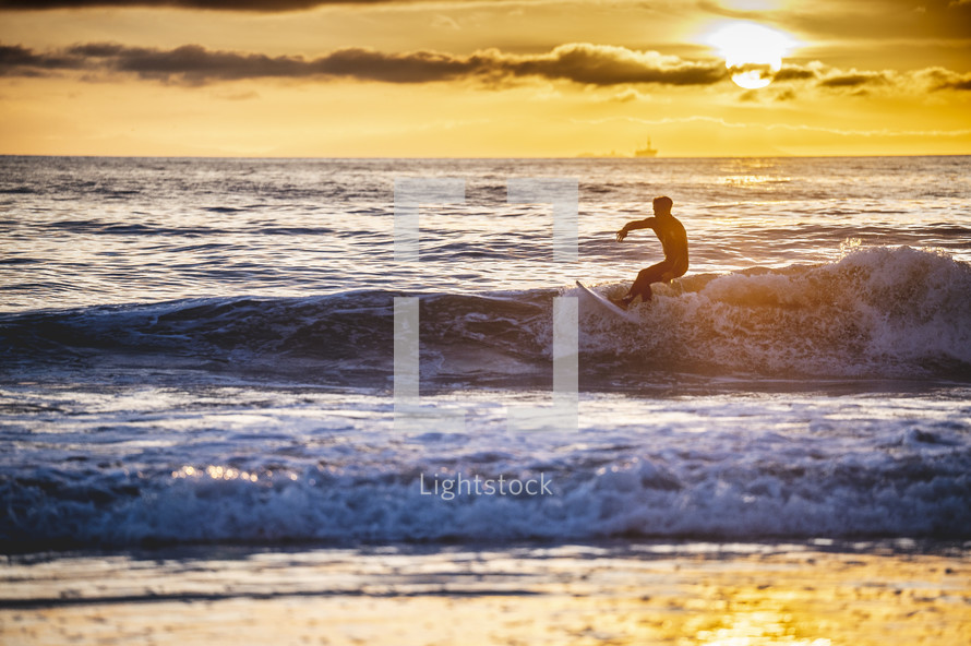 surfer catching a wave 