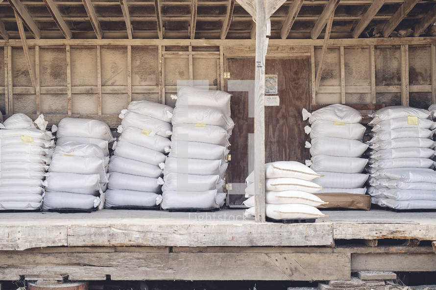 Stacked bags of flour in shed
