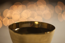 bokeh lights behind a chalice 