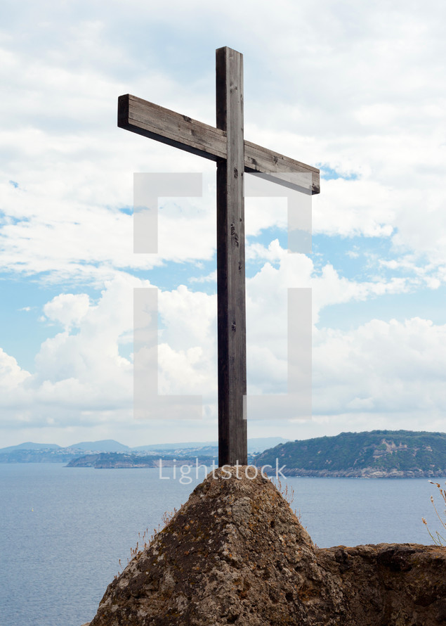 Wooden cross in the Aragonese Castle sheer above the sea