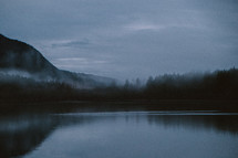 Fog and mist over a mountain lake 