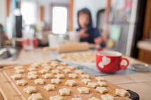 star shaped cookies and a kid in a kitchen 