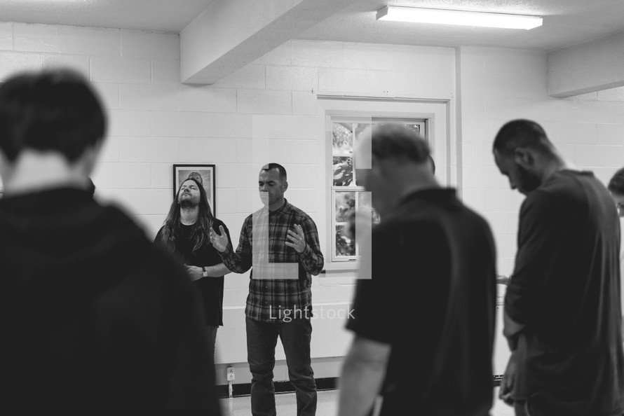 prayer during a men's group meeting 