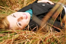 Woman lying in grass
