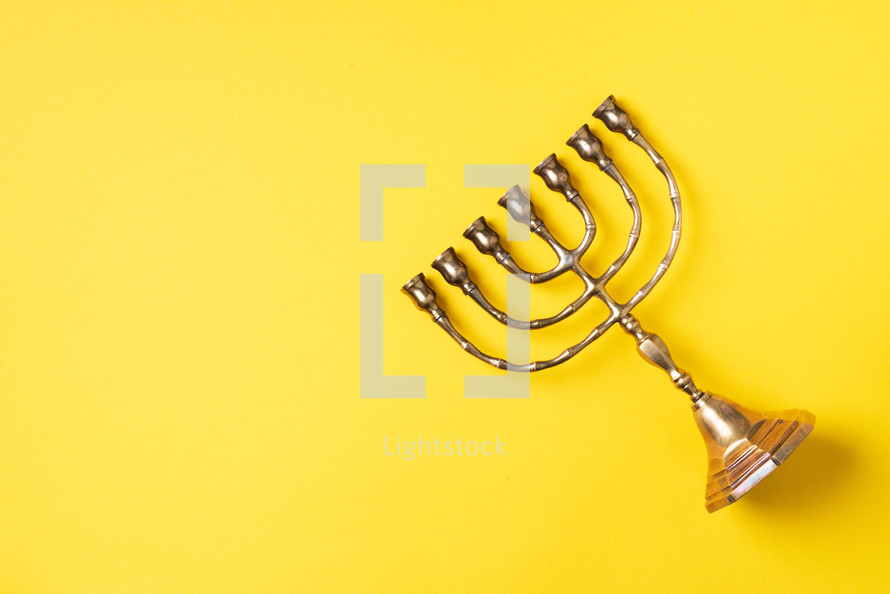 Golden hanukkah menorah. Jewish holiday banner with copy space. Ancient ritual religious candle menorah