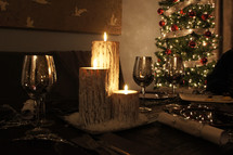 Christmas meal, cups, candles and tree