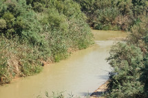 The Jordan River, possible location of Jesus' baptism, in Jordan