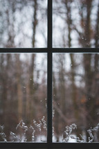 cross in an icy window 