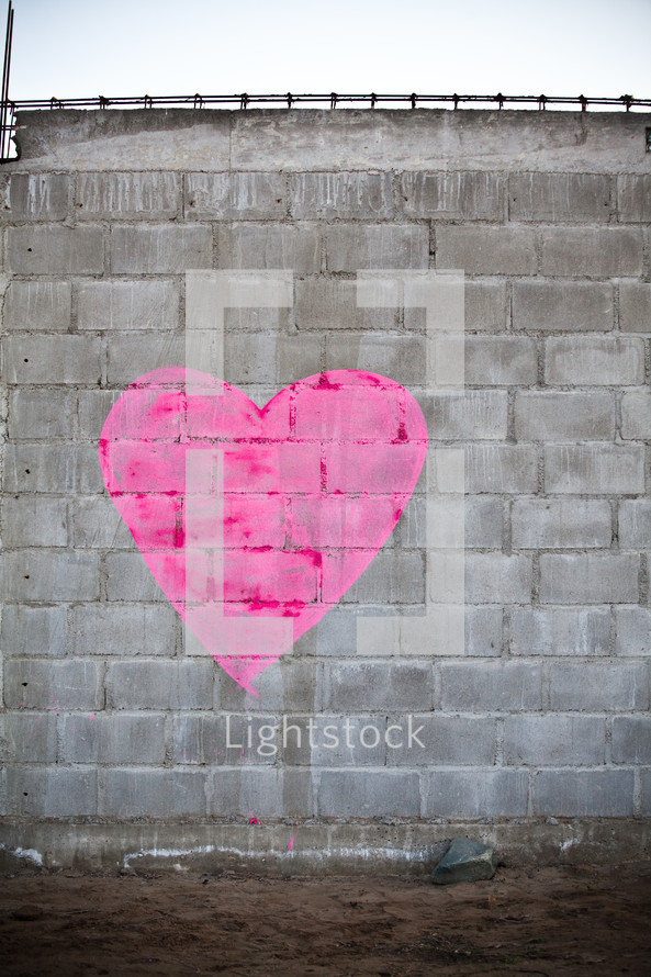 Heart painted on a brick wall.