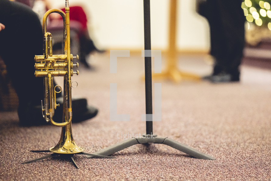 Trumpet on a floor stand with blurry background