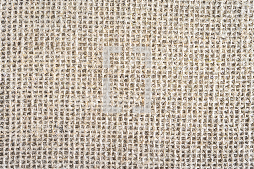 Abstract background, close up photo from a piece of Burlap fabric.