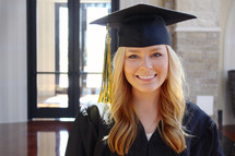 young woman in her cap and gown
