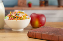 A Bible on a Wooden Table with Breakfast Set a Perfect Way to Start Your Day