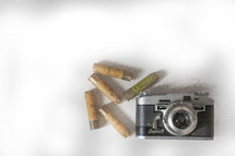 old shell casings and vintage camera 