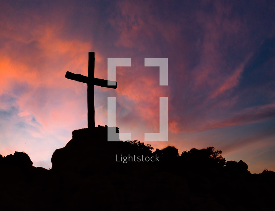 Silhouette of cross against the sunset