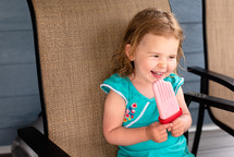 child eating a popsicle 