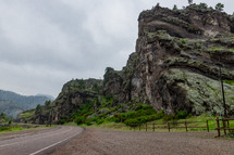 cliffs lining a road 
